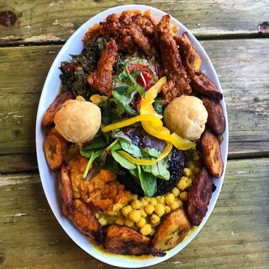 Dish of plantain and corn from Eat of Eden on a plate on a wooden table