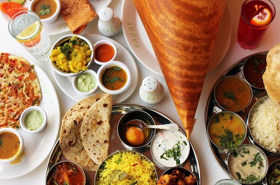 Full table set with mixture of South Indian dishes from Sagar Restaurant Hammersmith incluing rise and Masala Dosa