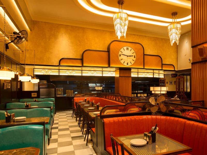 Interior of Dishoom with American-diner style booths and check floor