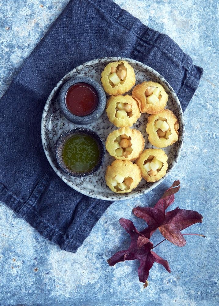 Picture of Indian pouri with dip on a blue marble plate